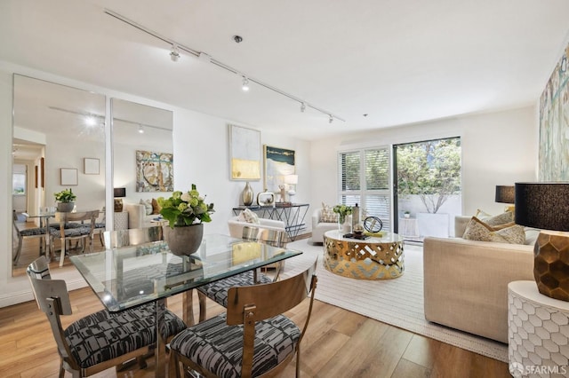 dining space with light hardwood / wood-style flooring