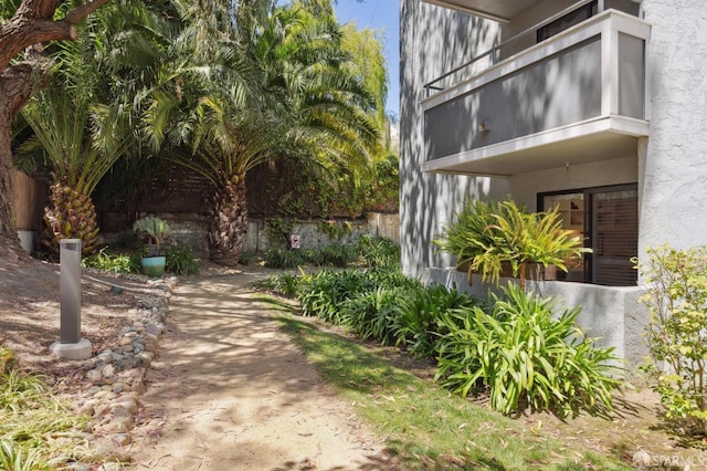 view of yard featuring a balcony