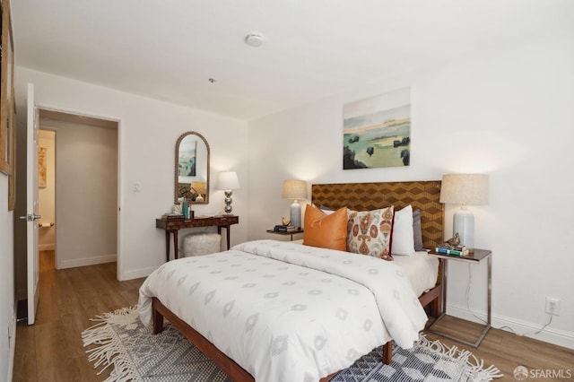 bedroom featuring wood-type flooring