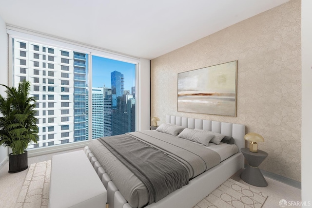 401 Harrison St Unit 23C, San Francisco, CA 94105 - carpeted bedroom with wallpapered walls, a city view, and multiple windows