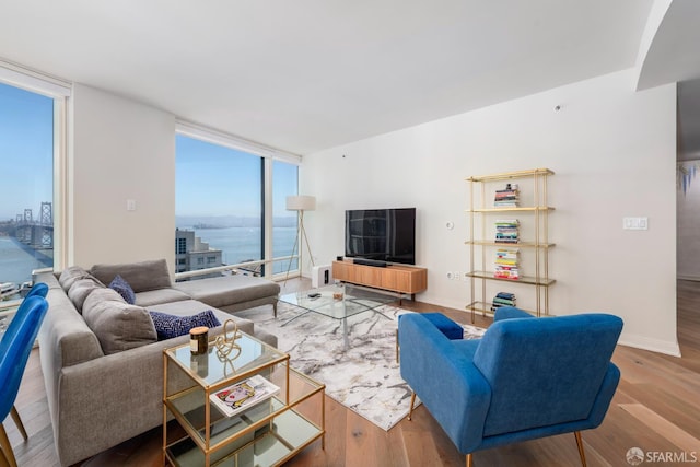 401 Harrison St Unit 23C, San Francisco, CA 94105 - living area with expansive windows and wood finished floors