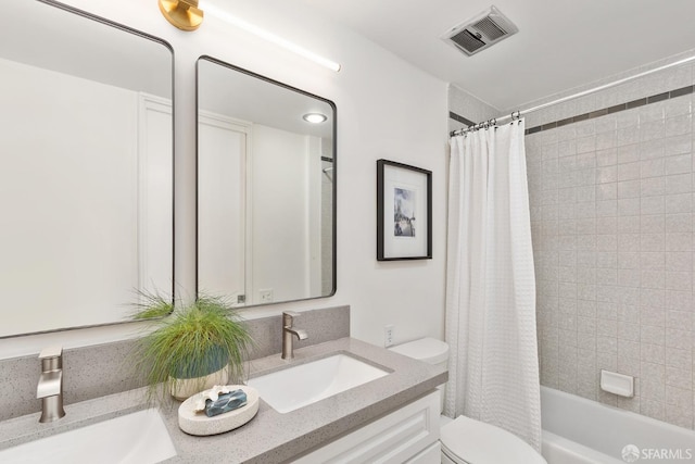 bathroom featuring toilet, double vanity, and shower / bathtub combination with curtain