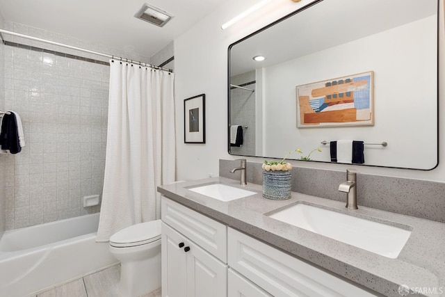 full bath featuring toilet, shower / bath combo, and double vanity