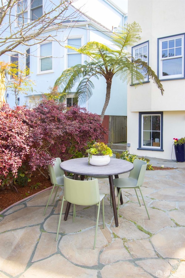 view of patio / terrace featuring outdoor dining space and fence