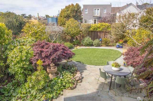 view of yard featuring a patio and fence