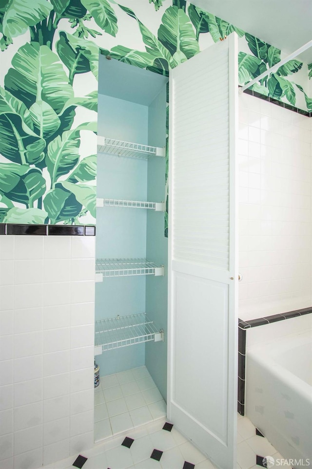 bathroom with tile patterned flooring