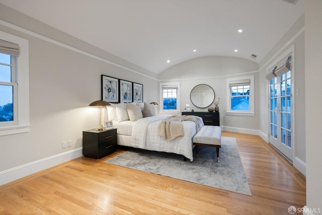 bedroom with lofted ceiling, recessed lighting, baseboards, and light wood finished floors