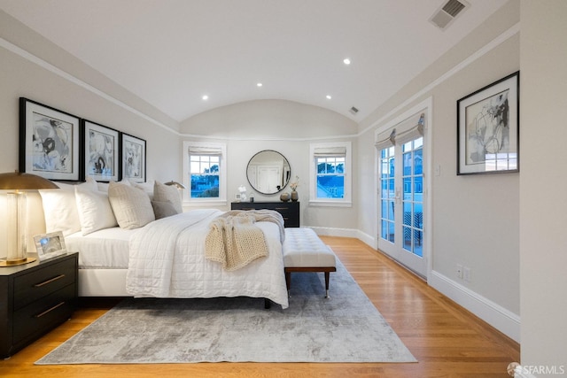 bedroom with visible vents, baseboards, lofted ceiling, recessed lighting, and light wood-style floors