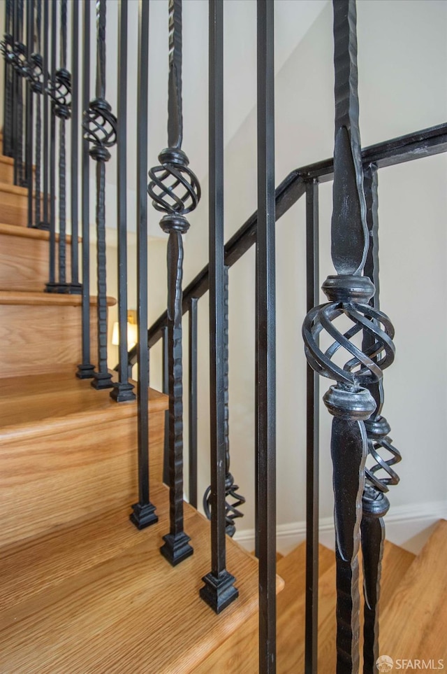 room details featuring baseboards and wood finished floors