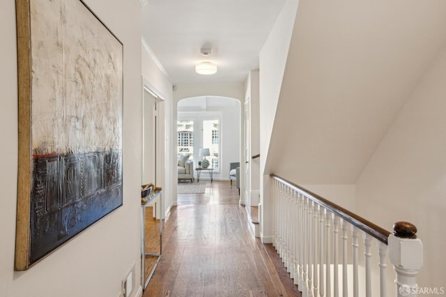 corridor featuring hardwood / wood-style floors and ornamental molding