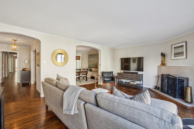 living room featuring crown molding and dark wood-type flooring