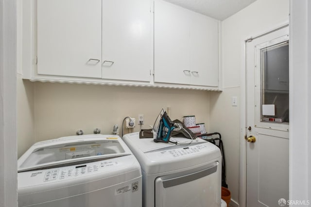 laundry area with cabinets and separate washer and dryer