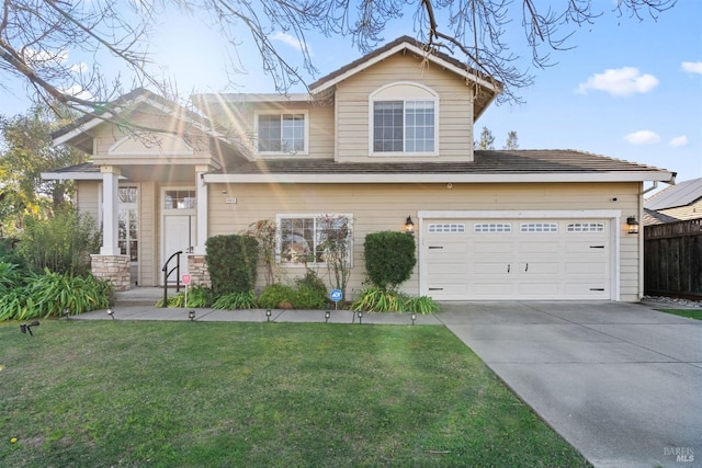 view of front of house featuring a garage and a front lawn