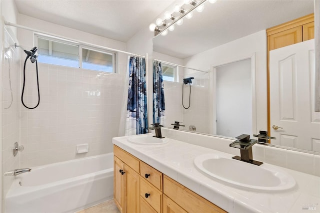 bathroom with vanity and shower / bath combination with curtain