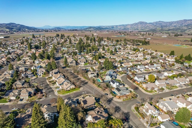 birds eye view of property with a mountain view