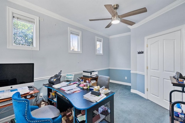 carpeted office space featuring ceiling fan, crown molding, and a healthy amount of sunlight