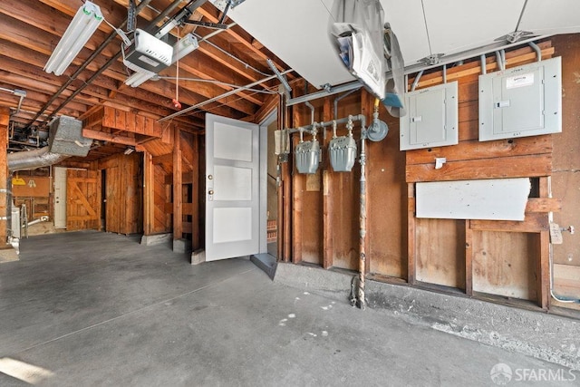 interior space with electric panel and a garage door opener