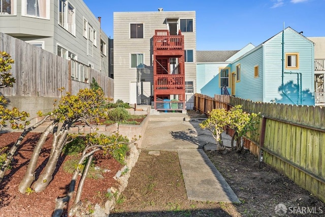 view of home's community with a fenced backyard