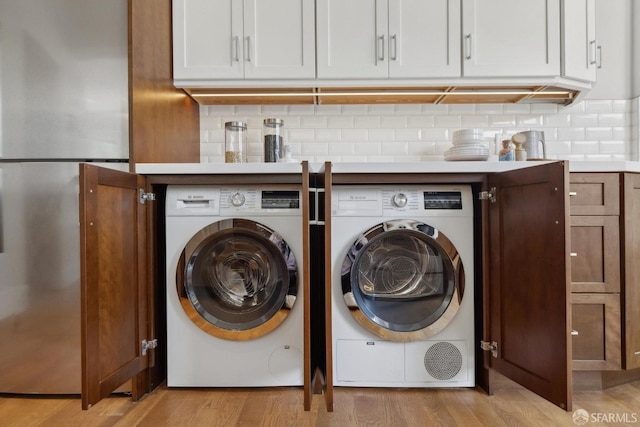 1500 Mcallister St Unit A, San Francisco, CA 94115 - laundry room featuring separate washer and dryer and light wood finished floors