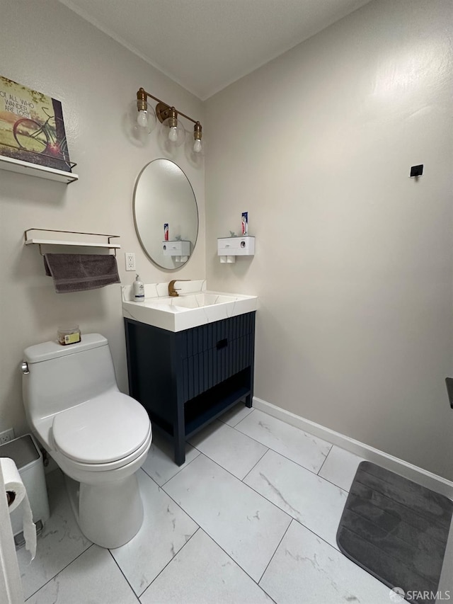 bathroom with vanity and toilet