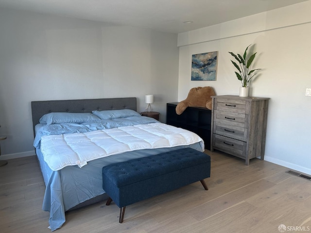 bedroom with light wood-type flooring