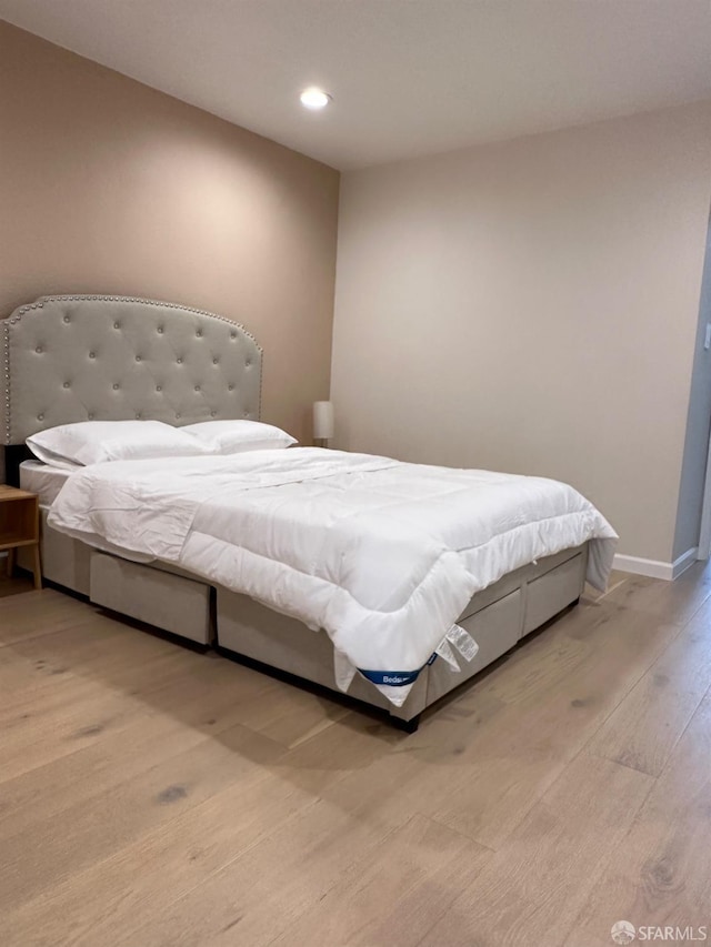 bedroom with light hardwood / wood-style floors