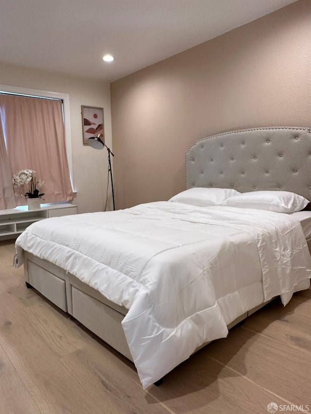 bedroom with light wood-type flooring