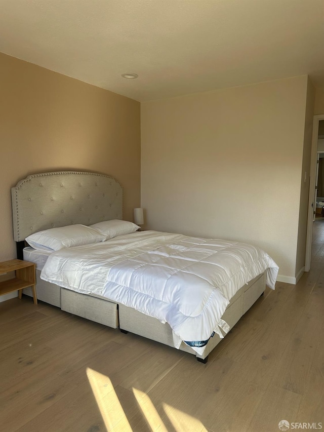 bedroom featuring hardwood / wood-style flooring