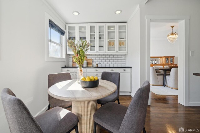 5 College Ter, San Francisco, CA 94112 - dining space featuring dark wood-style floors, a chandelier, baseboards, recessed lighting, and crown molding