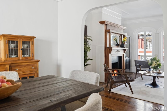 5 College Ter, San Francisco, CA 94112 - dining area featuring arched walkways, crown molding, wood finished floors, and a warm lit fireplace