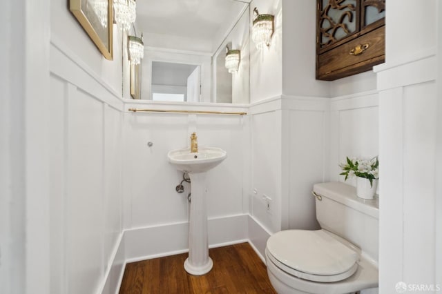 5 College Ter, San Francisco, CA 94112 - half bathroom featuring wood finished floors, toilet, and wainscoting