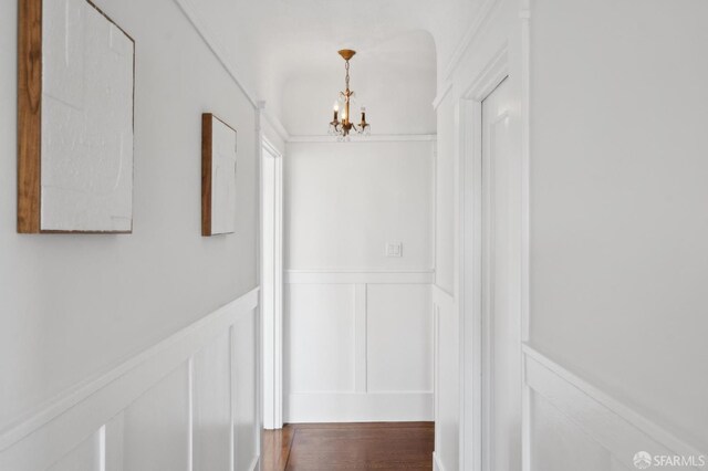 5 College Ter, San Francisco, CA 94112 - corridor featuring a decorative wall, a chandelier, a wainscoted wall, and dark wood finished floors