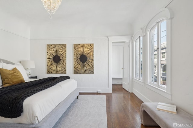 5 College Ter, San Francisco, CA 94112 - bedroom featuring multiple windows, wood finished floors, baseboards, and a chandelier