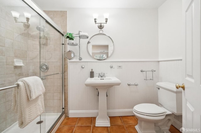 5 College Ter, San Francisco, CA 94112 - bathroom with a stall shower, a wainscoted wall, toilet, and tile patterned flooring