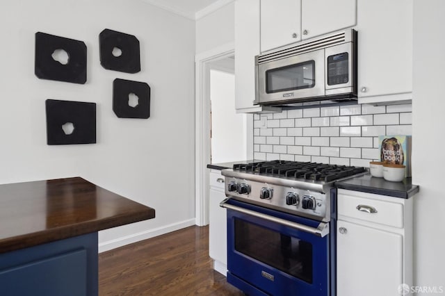 5 College Ter, San Francisco, CA 94112 - kitchen featuring stainless steel appliances, dark countertops, ornamental molding, backsplash, and white cabinetry