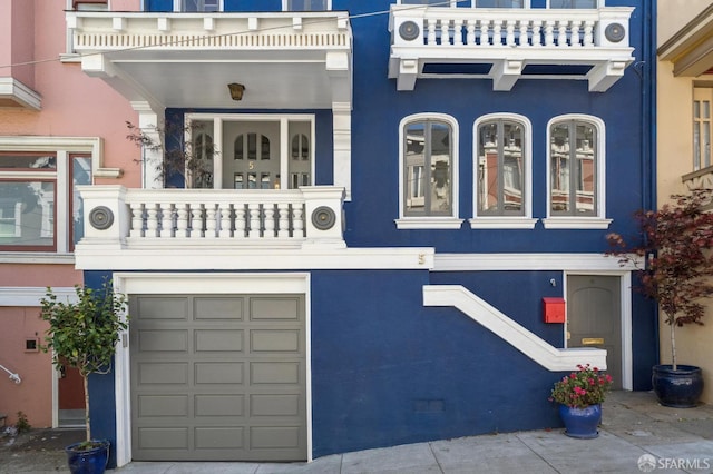 5 College Ter, San Francisco, CA 94112 - view of front facade with a balcony, an attached garage, and stucco siding