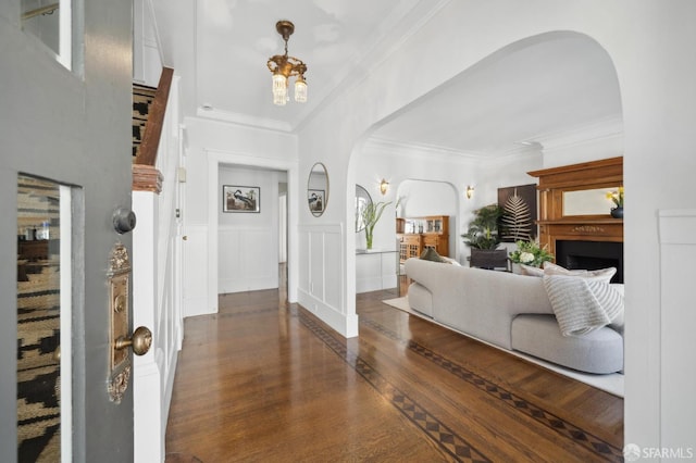 5 College Ter, San Francisco, CA 94112 - foyer entrance with arched walkways, wood finished floors, crown molding, wainscoting, and a decorative wall