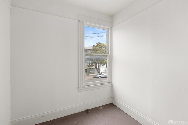 spare room featuring baseboards