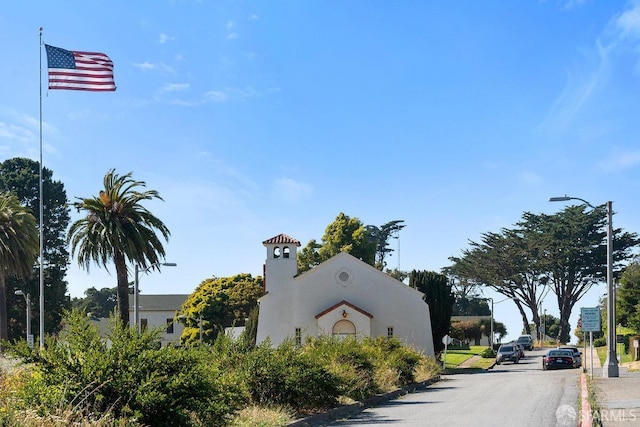 view of street featuring sidewalks and curbs