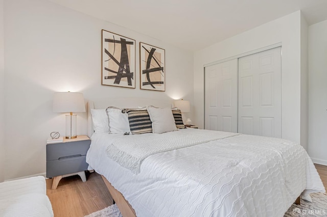 611 Stonegate Dr, South San Francisco, CA 94080 - bedroom with a closet, wood finished floors, and baseboards