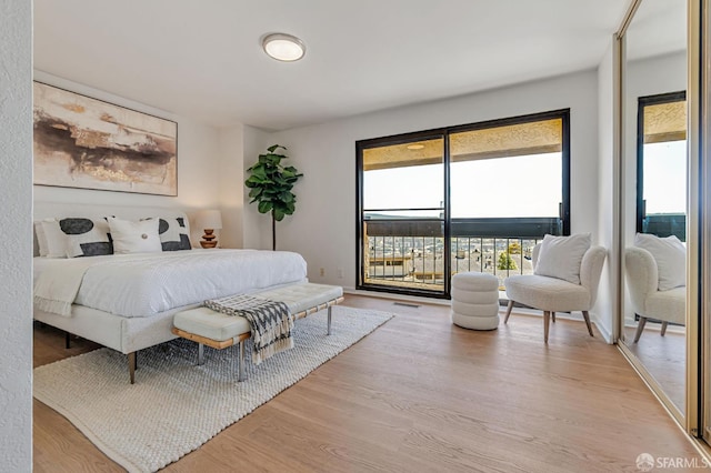 611 Stonegate Dr, South San Francisco, CA 94080 - bedroom featuring access to exterior, multiple windows, and wood finished floors