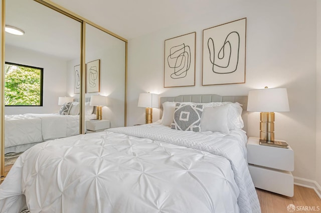 611 Stonegate Dr, South San Francisco, CA 94080 - bedroom featuring wood finished floors, a closet, and baseboards