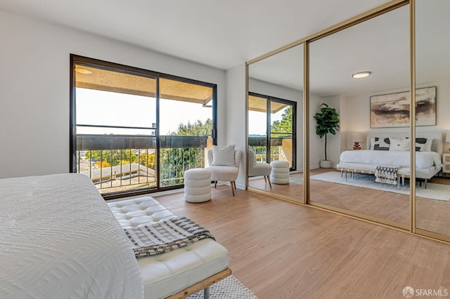 611 Stonegate Dr, South San Francisco, CA 94080 - bedroom featuring wood finished floors and access to exterior