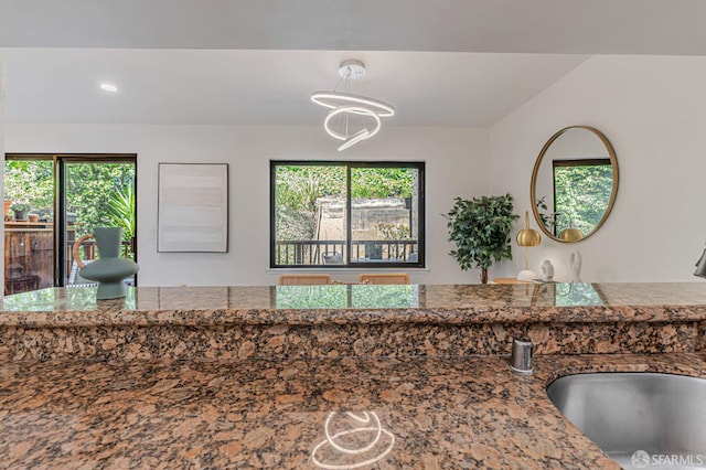611 Stonegate Dr, South San Francisco, CA 94080 - kitchen view of a sink, a chandelier, recessed lighting, stone countertops, and hanging light fixtures