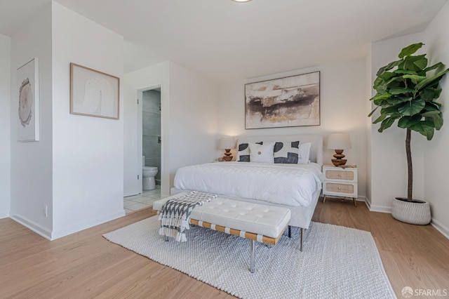 611 Stonegate Dr, South San Francisco, CA 94080 - bedroom with wood finished floors, baseboards, and ensuite bath