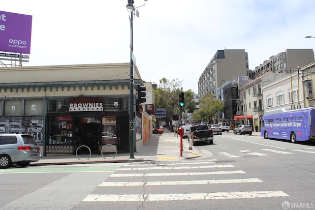 1155 Leavenworth St Unit 7, San Francisco, CA 94109 - view of asphalt street featuring street lights, sidewalks, curbs, and traffic lights