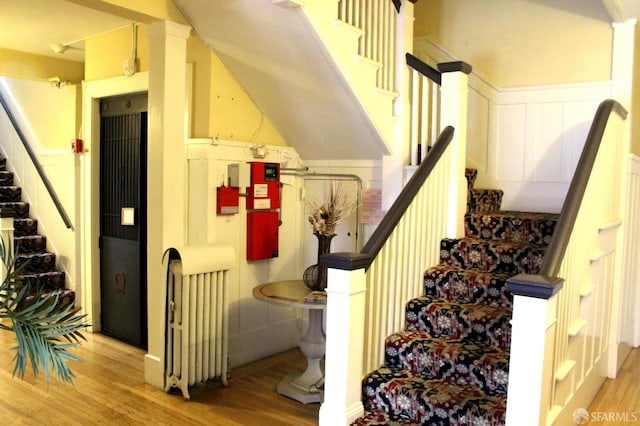 1155 Leavenworth St Unit 7, San Francisco, CA 94109 - stairs featuring wood finished floors and a decorative wall