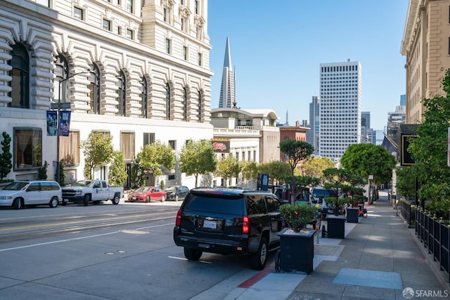1155 Leavenworth St Unit 7, San Francisco, CA 94109 - view of asphalt road featuring sidewalks, street lighting, curbs, and a view of city