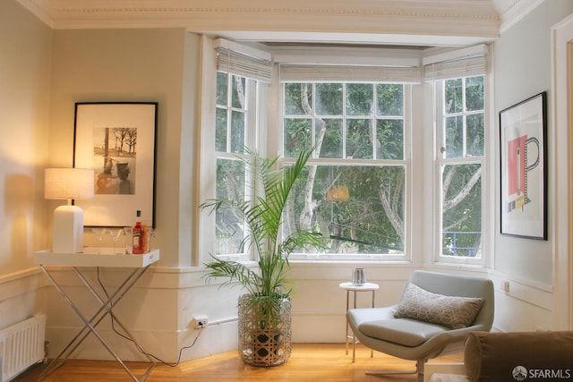 1155 Leavenworth St Unit 7, San Francisco, CA 94109 - sitting room with radiator, plenty of natural light, crown molding, and wood finished floors