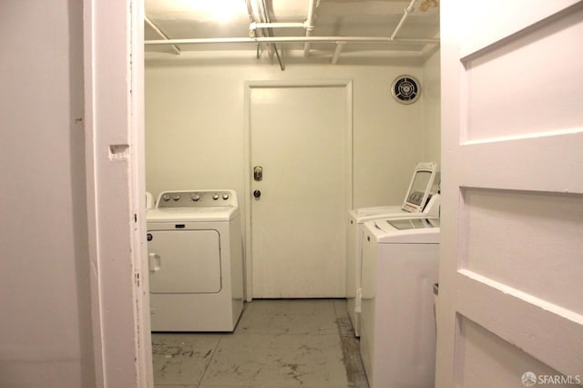 1155 Leavenworth St Unit 7, San Francisco, CA 94109 - laundry area featuring washer and dryer and light marble finish flooring